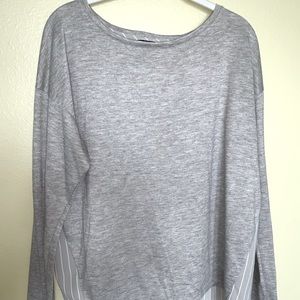 Ann Taylor woman’s, long sleeve, high-low blouse in grey. Size medium.